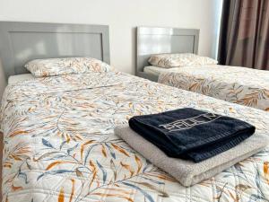 Voodi või voodid majutusasutuse Scanderbeg Square 2BR APT toas