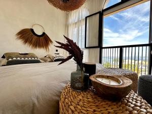 a bedroom with a bed with a bowl on a table at Apartamento Tulum in San Blas