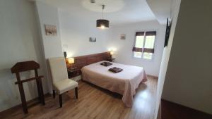 Postel nebo postele na pokoji v ubytování Hôtel du Roc