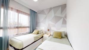 Posteľ alebo postele v izbe v ubytovaní Apartamento Bianca Beach