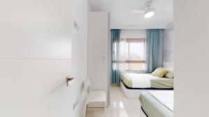 Posteľ alebo postele v izbe v ubytovaní Apartamento Bianca Beach