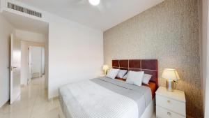 Posteľ alebo postele v izbe v ubytovaní Apartamento Bianca Beach