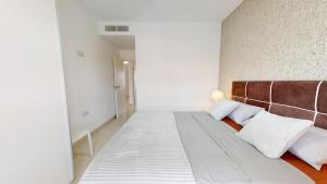 Posteľ alebo postele v izbe v ubytovaní Apartamento Bianca Beach