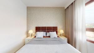 Posteľ alebo postele v izbe v ubytovaní Apartamento Bianca Beach