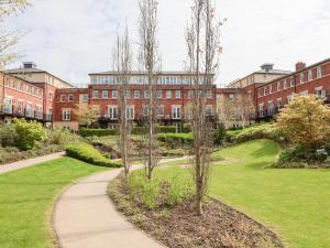 a walkway in front of a brick building at 122 The Old Meadow in Shrewsbury