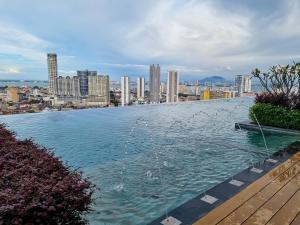 a pool with a fountain in the middle of a city at Victoria Beacon Executive Suites by Bin Dao Wu Homestay Penang in George Town