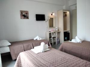 Posteľ alebo postele v izbe v ubytovaní Nikolas ios Village