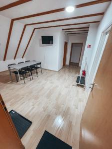 a large room with a table and chairs in it at Granny Smith in Neuhofen