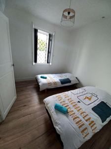 Ένα ή περισσότερα κρεβάτια σε δωμάτιο στο Le scandinave de Vendargues