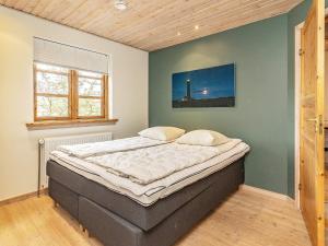 Postel nebo postele na pokoji v ubytování 10 person holiday home in Skagen