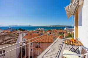 a balcony with a view of a city at Apartments Kala in Crikvenica
