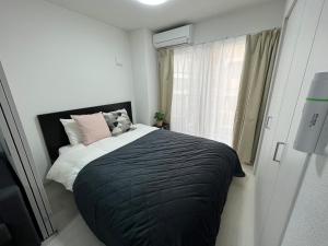 Apartment Namba Style VR 객실 침대
