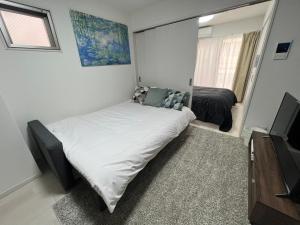 Apartment Namba Style VR 객실 침대