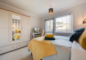 a bedroom with a large bed and a window at Brigantine in Martham