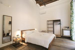 Postel nebo postele na pokoji v ubytování Antica Residenza Fusco