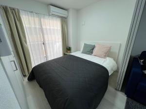 Apartment Namba Style VR 객실 침대