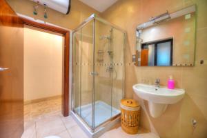 a bathroom with a shower and a sink at Enormous 3bedrooms seafront with balcony PDEH1-1 in Sliema