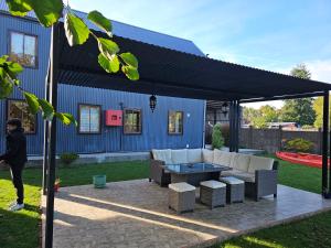 a patio with a couch and a table under a canopy at Cabañas Rosner in Valdivia