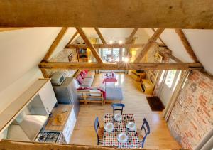 an overhead view of a kitchen and living room in a loft at Crossways Barn in Briston