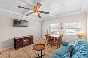 a living room with a blue couch and a table at Great Location 1BR Pool Parking Pets Allowed 5 in Myrtle Beach