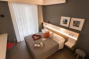 a hotel room with a bed with a heart on it at Bed In Centro in Naples +37 photos