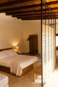 Katil atau katil-katil dalam bilik di Borgo delle Pietre