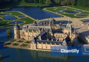 an aerial view of a castle in the water at Le Nordik proche aéroport CDG I Paris I Astérix in Dammartin-en-Goële