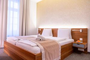 Voodi või voodid majutusasutuse Hotel Engel am Bahnhof toas