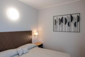 Postel nebo postele na pokoji v ubytování Hotel Boston