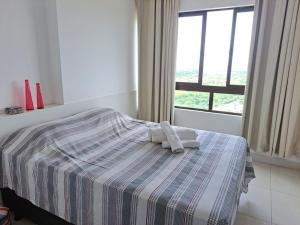 Ένα ή περισσότερα κρεβάτια σε δωμάτιο στο Apartamento Fantástico - com estação para carros eletricos