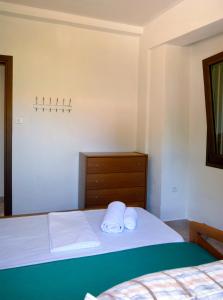 Postel nebo postele na pokoji v ubytování Amaryllis Summer Maisonettes