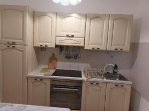 Kuchyňa alebo kuchynka v ubytovaní L'appartamento delle vacanze