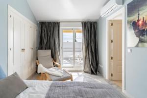 Posteľ alebo postele v izbe v ubytovaní Apartamento Giralda + 21 fotografií