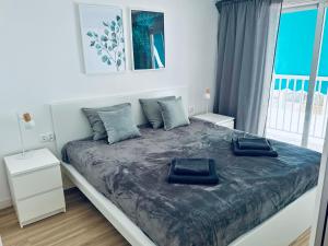 Łóżko lub łóżka w pokoju w obiekcie Welcome & Bienvenido a Santa Pola Apartamento a 30 metros de la Gran Playa