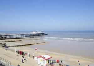 an aerial view of a beach with a pier at Horseshoe Cottage in Cromer