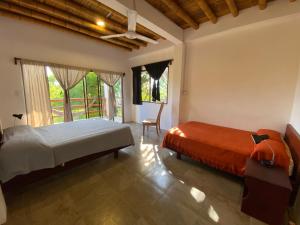 Letto o letti in una camera di Hosteria Guachapeli