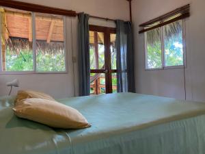 Letto o letti in una camera di Hosteria Guachapeli