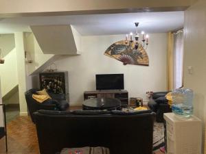 TV a/nebo společenská místnost v ubytování Eve Homestay