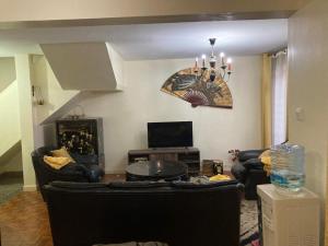 TV a/nebo společenská místnost v ubytování Eve Homestay