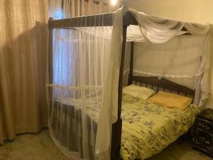 Postel nebo postele na pokoji v ubytování Eve Homestay