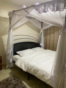 Postel nebo postele na pokoji v ubytování Eve Homestay