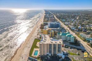 an aerial view of the beach and the ocean at Oceania Beach Club Superior Beachfront Condos in New Smyrna Beach