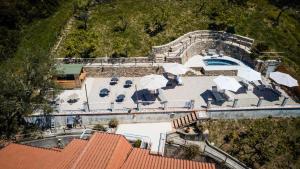 an aerial view of a house with a patio and a pool at Villa Santa Sofia in Ascea