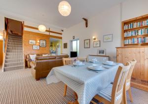 a living room with a table and a couch at Little Barn in Upton