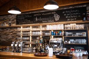 a bar with a chalkboard on the wall at Apartment Elisabeth in Kaumberg
