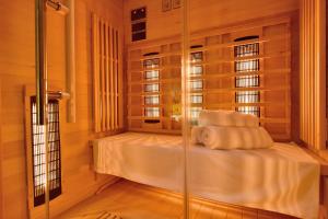a room with a bed with a glass wall at Azzurro apartment - with private rooftop jacuzzi in Zadar +57 photos