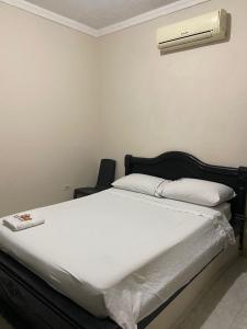 Cama o camas de una habitación en HOTEL BUENA VISTA