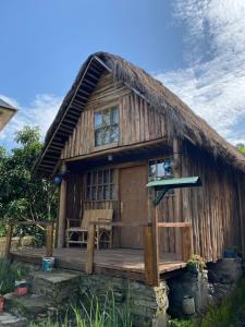a small house with a thatched roof at Kalitusi Nature Resort in Fort Portal