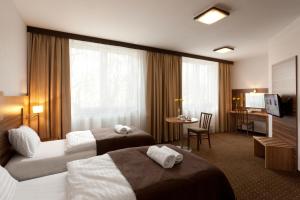 Katil atau katil-katil dalam bilik di Hotel Milenium
