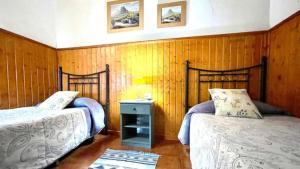 Łóżko lub łóżka w pokoju w obiekcie Casa Rural Ondina